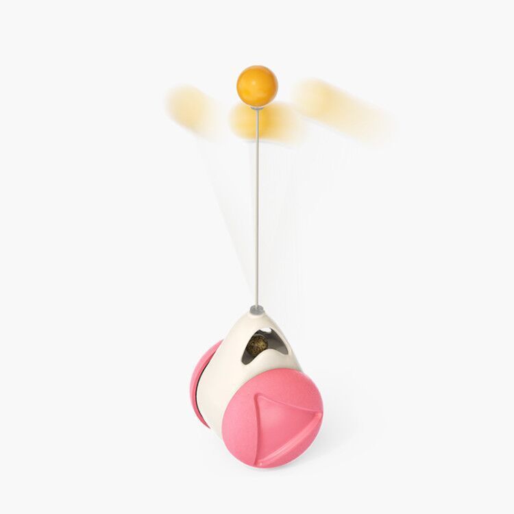 Interactive catnip toy with pink wheels and spinning yellow ball on white background