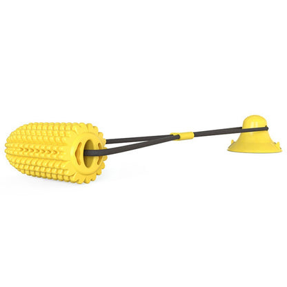 Yellow corn-shaped interactive dog chew toy with durable black rope and suction cup