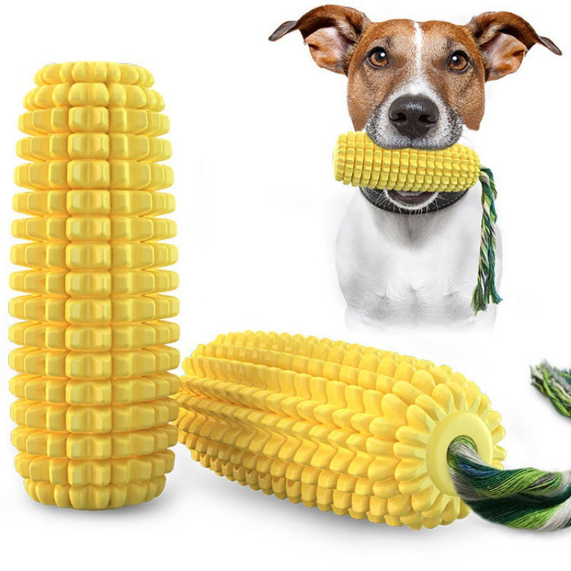 Dog holding yellow corn-shaped durable TPR chew toy with rope, shown with two chew toys on white background