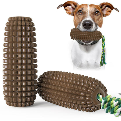 Dog holding brown corn-shaped chew toy with green and yellow rope, durable interactive dog dental toy