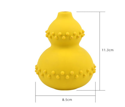 Yellow interactive dog treat dispensing toy made of chew-resistant natural rubber with textured bumps, 11.3cm tall