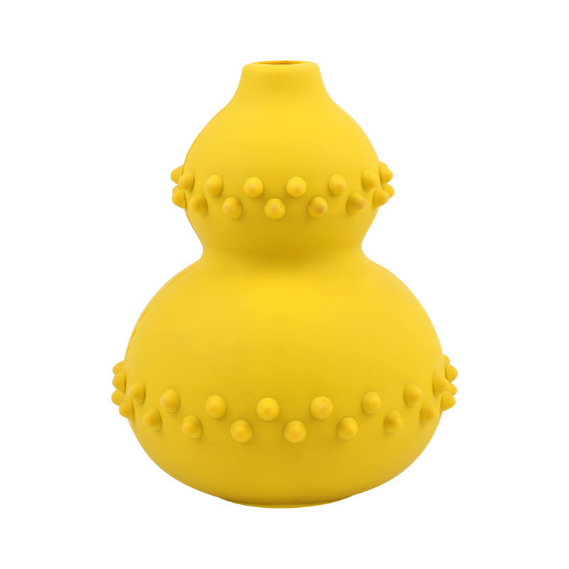 Yellow interactive dog treat dispensing toy in a gourd shape with chew-resistant rubber and textured bumps