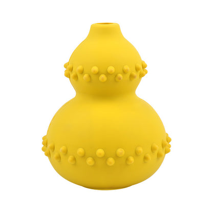 Yellow interactive dog treat dispensing toy in a gourd shape with chew-resistant rubber and textured bumps
