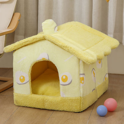 Yellow plush cozy cat house shaped like a fried egg with soft removable cover on wooden floor