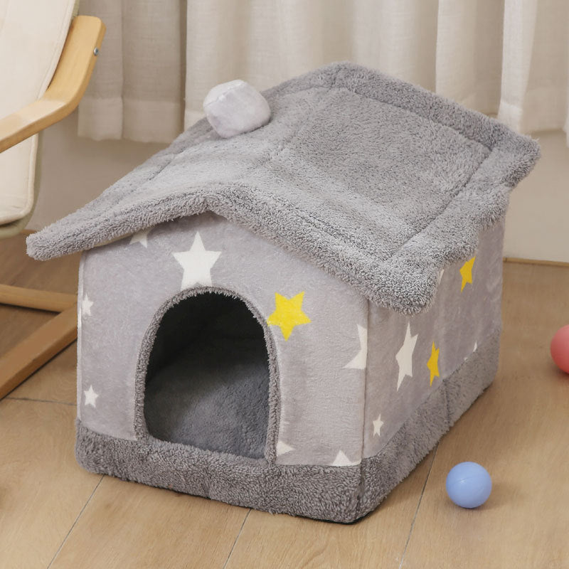 Cozy gray plush pet house with star patterns and soft removable cover on wooden floor
