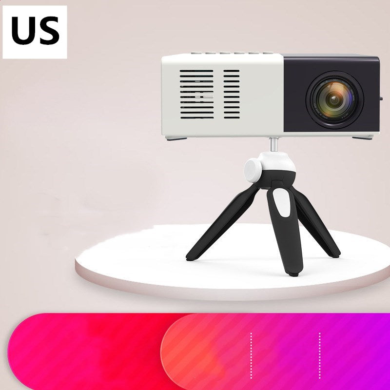 Compact white and black portable mini LED projector on black tripod stand on round white platform