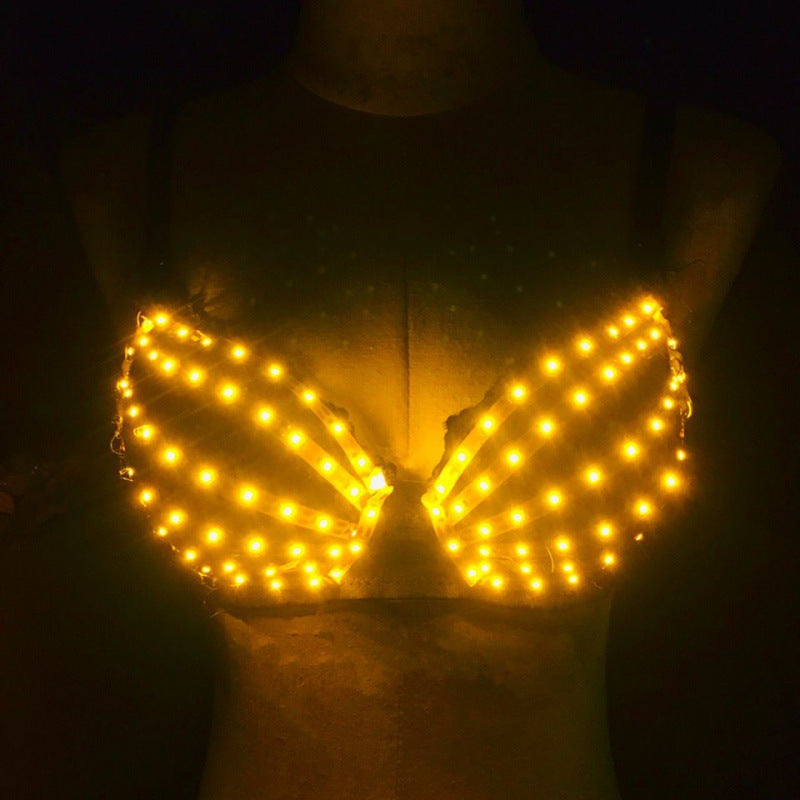 Luminous cotton bra with yellow LED lights on mannequin in dark setting