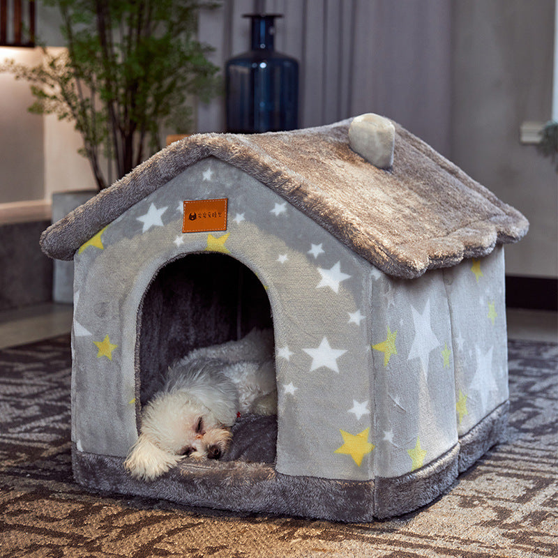 Small white dog sleeping inside cozy gray pet house with yellow and white star pattern and plush roof
