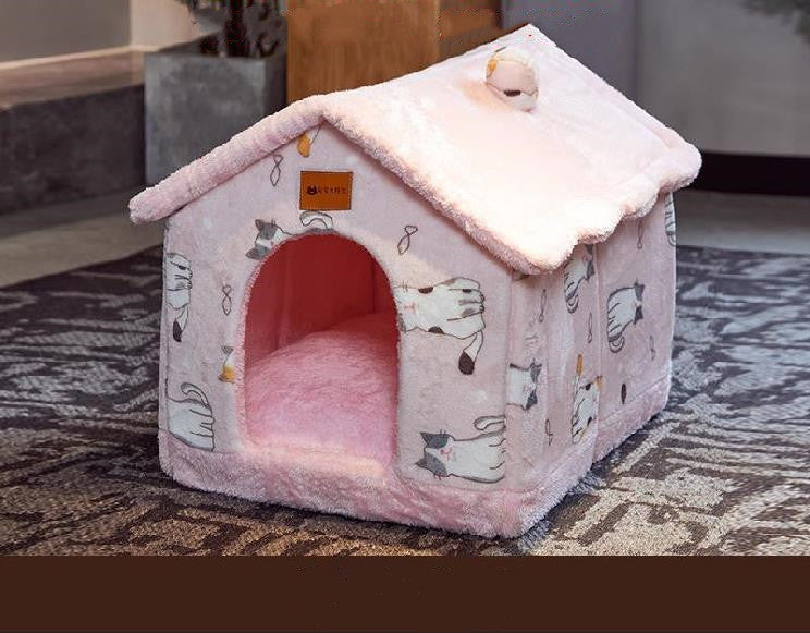 Pink plush pet house with cartoon cat prints and soft interior bed on living room carpet