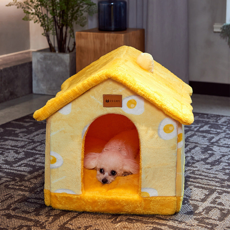 Small white dog resting inside a yellow omelette-patterned cozy pet house with plush fur bed