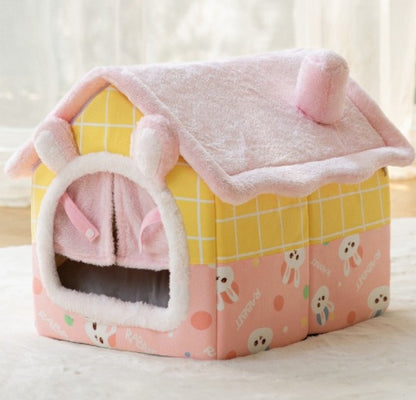 Small cozy pet house shaped like a yellow and pink omelette with synthetic plush fur and warm interior