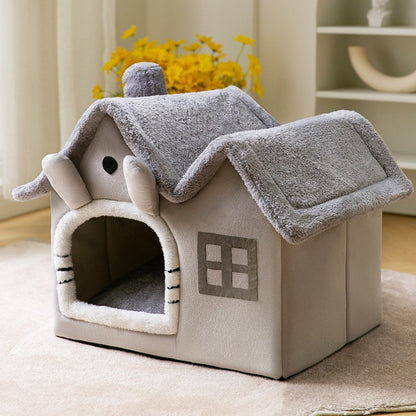 Gray plush cozy pet house with soft roof and window on beige carpet in bright room