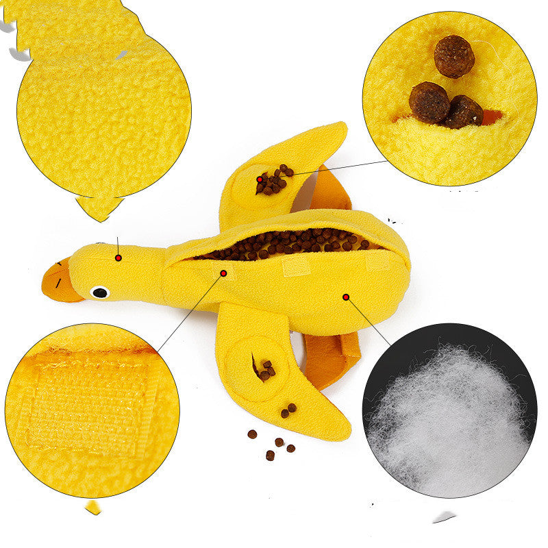 Yellow plush duck dog toy with interactive treat compartments and soft stuffing