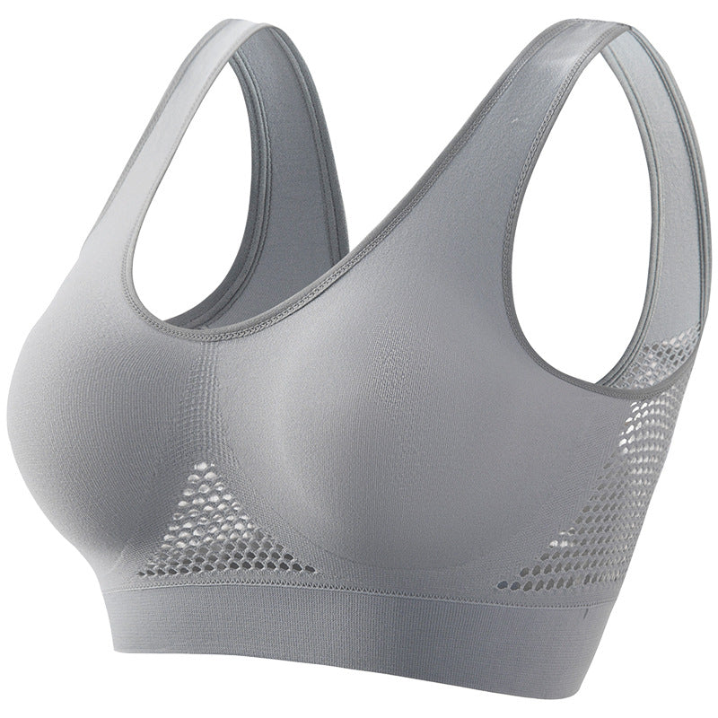Gray seamless breathable sports bra with mesh ventilation panels and wide shoulder straps