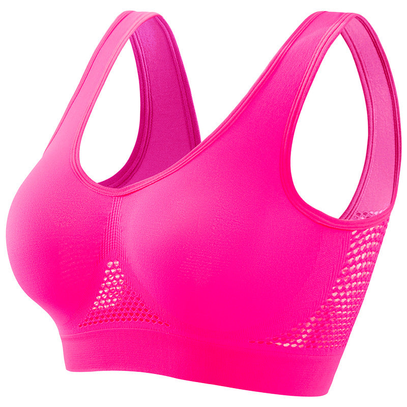 Bright pink seamless breathable sports bra with mesh panels for comfort and support