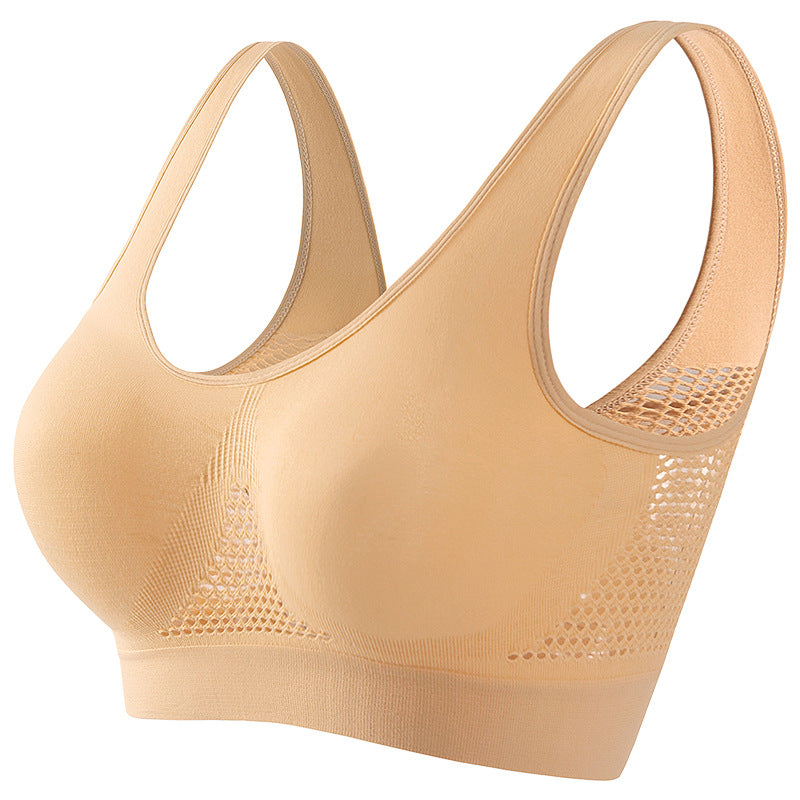 Beige seamless breathable sports bra with wide straps and mesh side panels for comfort fit