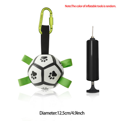 Durable white and black dog football toy with green handles and carabiner, includes black air pump