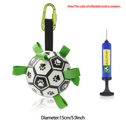 Durable dog football toy with black and white paw print design, green pull loops, carabiner, and blue ball pump