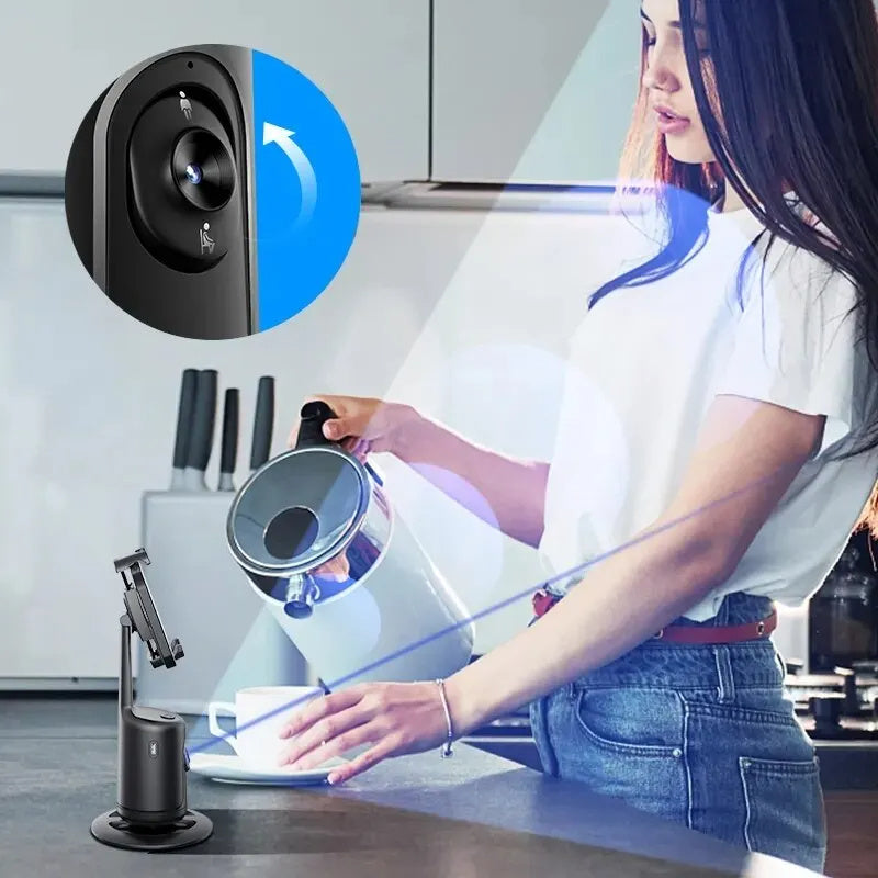 Black smart gimbal phone holder with 360-degree rotation and auto face tracking in kitchen