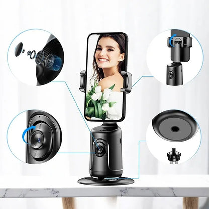 Black AI smart gimbal phone holder with 360-degree rotation and auto face tracking on marble table
