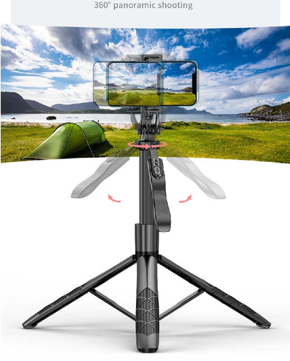 Black AI smart gimbal tripod with 360° rotation holding a phone capturing panoramic landscape with green tent