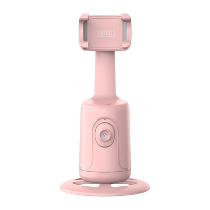 Pink mini AI smart gimbal with 360-degree rotation phone holder on round base