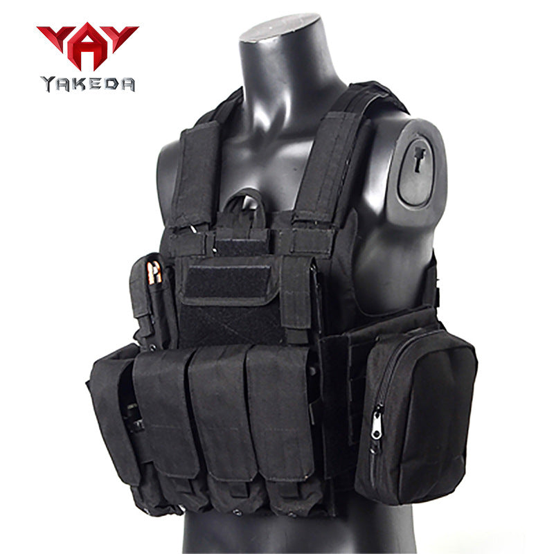 Black tactical combat vest with multiple pouches on a mannequin torso, military gear