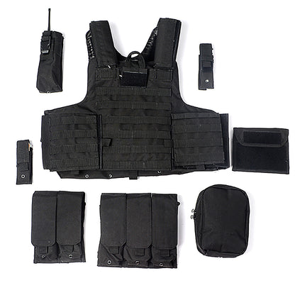 Black tactical combat vest with multiple detachable pouches and military gear accessories arranged on white background