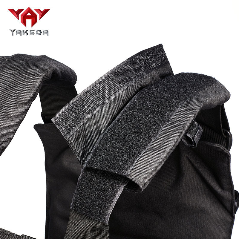 Close-up of durable black tactical vest straps with hook and loop fasteners, 1000D polyester fabric