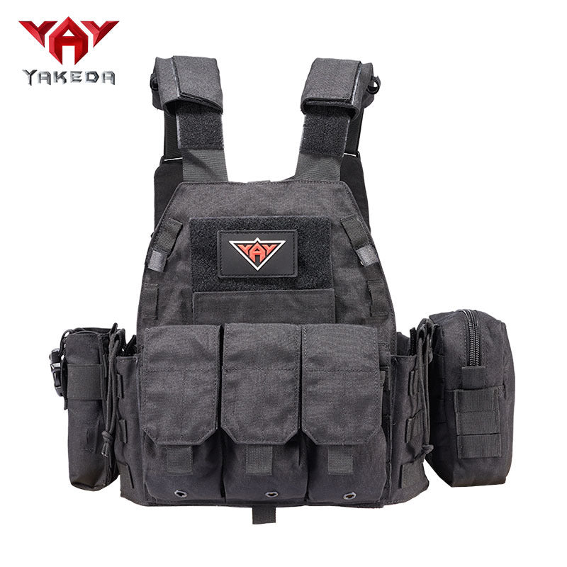 Black tactical vest with adjustable shoulder straps and multiple front and side pouches