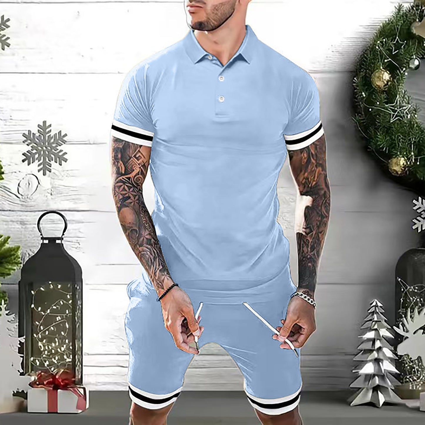 Man wearing light blue men's polo shirt and shorts set with white and black striped sleeves and hem