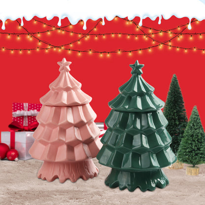Green and pink ceramic Christmas tree decorations on fur rug with wrapped presents and lights