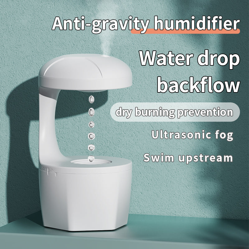 White anti-gravity humidifier with floating water drop design and ultrasonic fog on green background