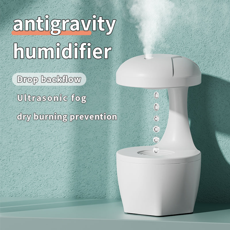 White antigravity humidifier releasing ultrasonic fog with drop backflow and dry burning prevention