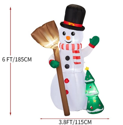 6ft inflatable snowman with top hat holding broom beside illuminated Christmas tree decoration
