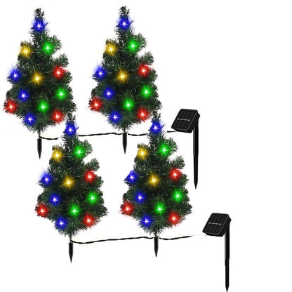 Set of four solar-powered mini Christmas trees with multicolor LED lights and stakes for outdoor decoration