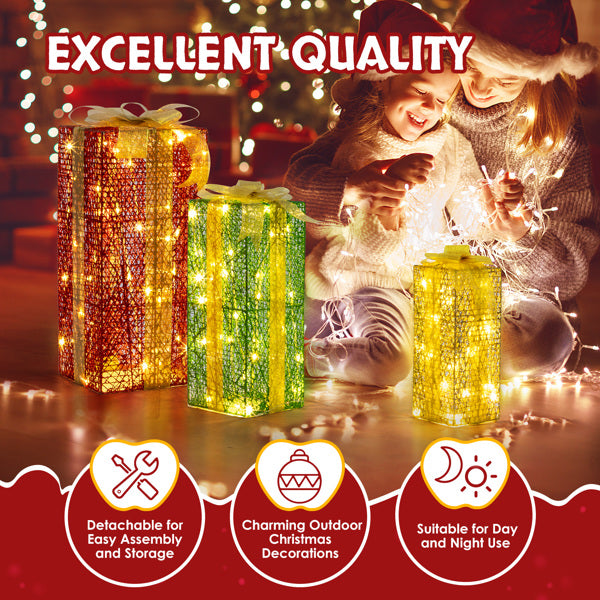 Three warm white LED lighted gift box decorations in red, green, and yellow with mother and child enjoying Christmas lights