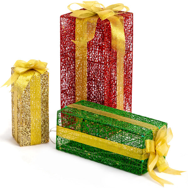 Three lighted decorative gift boxes in red, green, and gold with golden ribbon bows