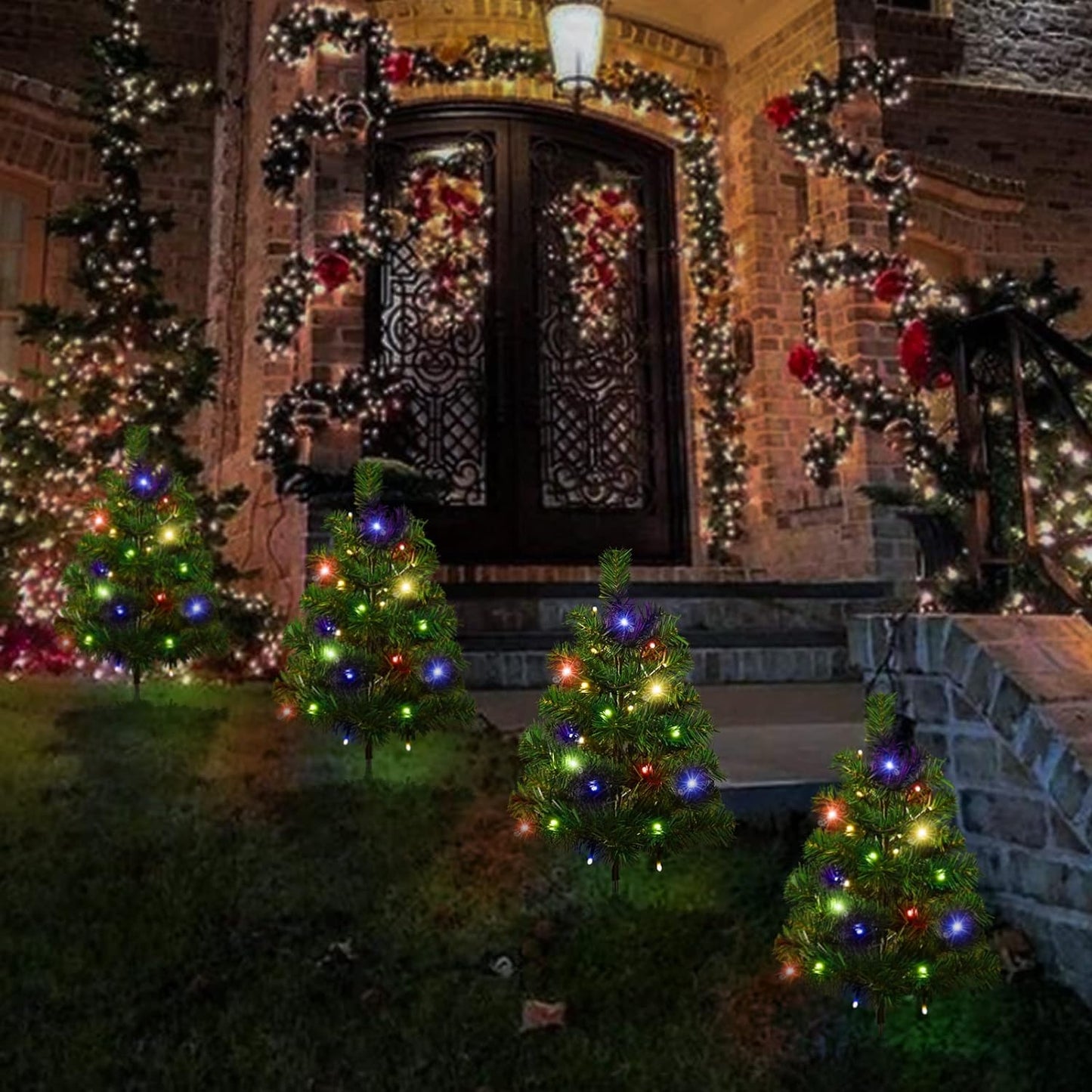 Front porch decorated with multicolored LED Christmas tree pathway lights and festive garlands