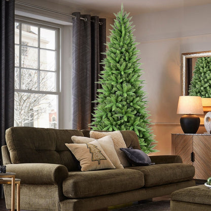 4ft artificial PVC Christmas tree with 424 tips in a cozy living room beside a brown sofa and lamp
