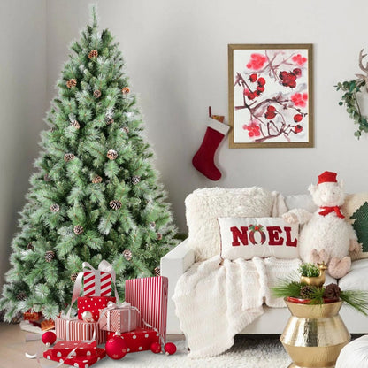 PVC Christmas tree with pine cones next to white sofa, red stocking, gifts, and holiday decor in living room