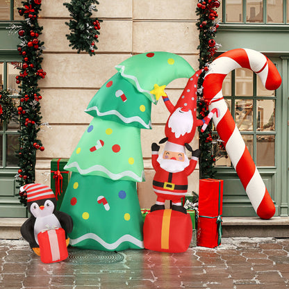 Outdoor Christmas inflatable decorations featuring Santa, Christmas tree, candy cane, penguin, and wrapped presents