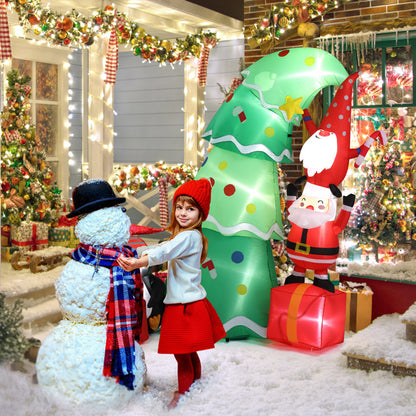 Girl in red hat and skirt building snowman in festive yard with Christmas inflatable tree and Santa decoration