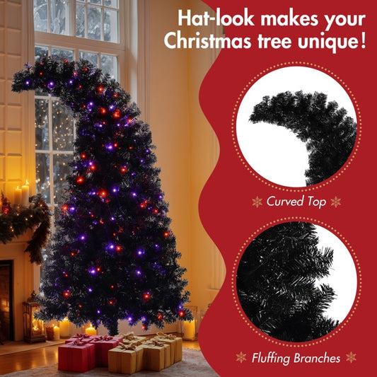 Black artificial Christmas tree with curved top resembling a hat, decorated with colorful LED lights, set by a window with wrapped gifts beneath