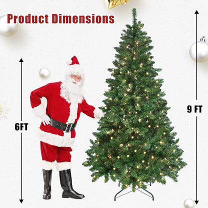 Santa Claus standing next to a 9-foot pre-lit artificial Christmas tree with green PVC branches