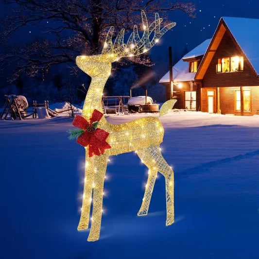 Lighted 4ft outdoor Christmas reindeer decoration with red bow in snowy yard at night