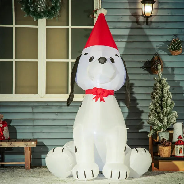 Inflatable white dog with red Santa hat and bow, outdoor Christmas yard decoration at night