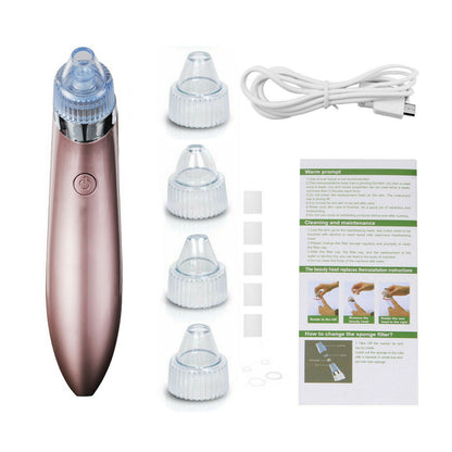 Rose gold electric blackhead remover with four suction heads, USB cable, and instruction manual