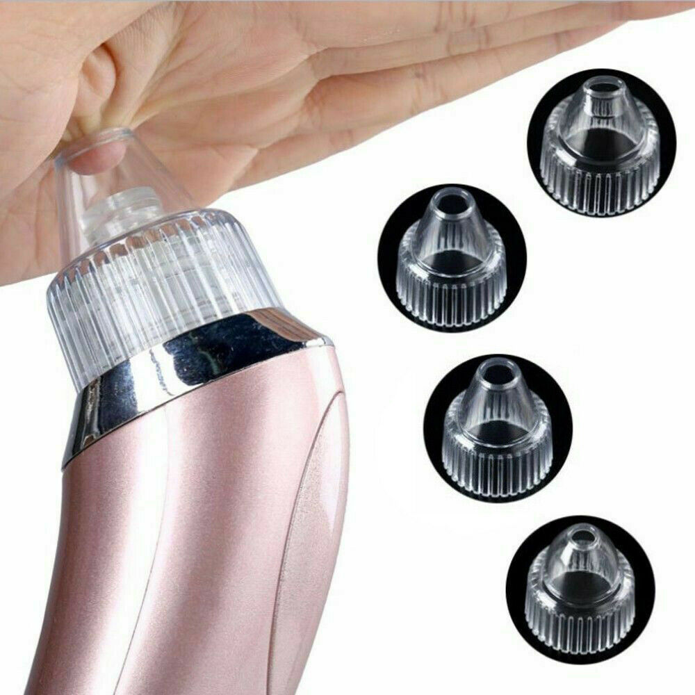 Electric blackhead remover with pink body and four transparent suction heads