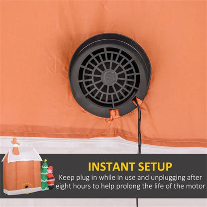 Close-up of black fan vent on orange inflatable gingerbread house with Santa and LED lights